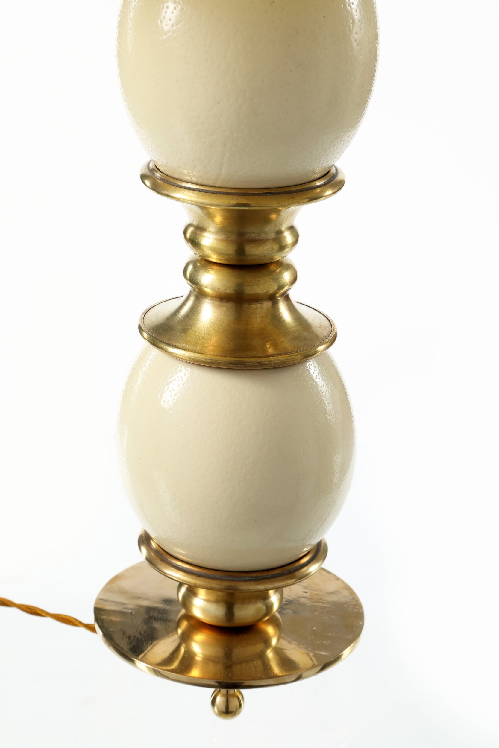Ostrich egg and brass lamp