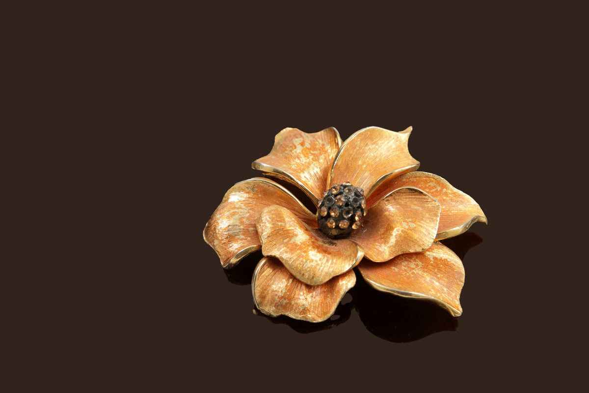 Orange flower and rhinestone metal brooch