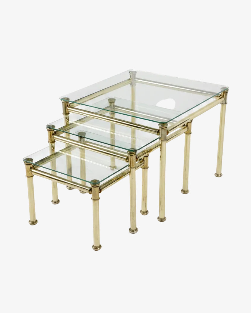 Triptych of brass and smoked glass tables from the 70s