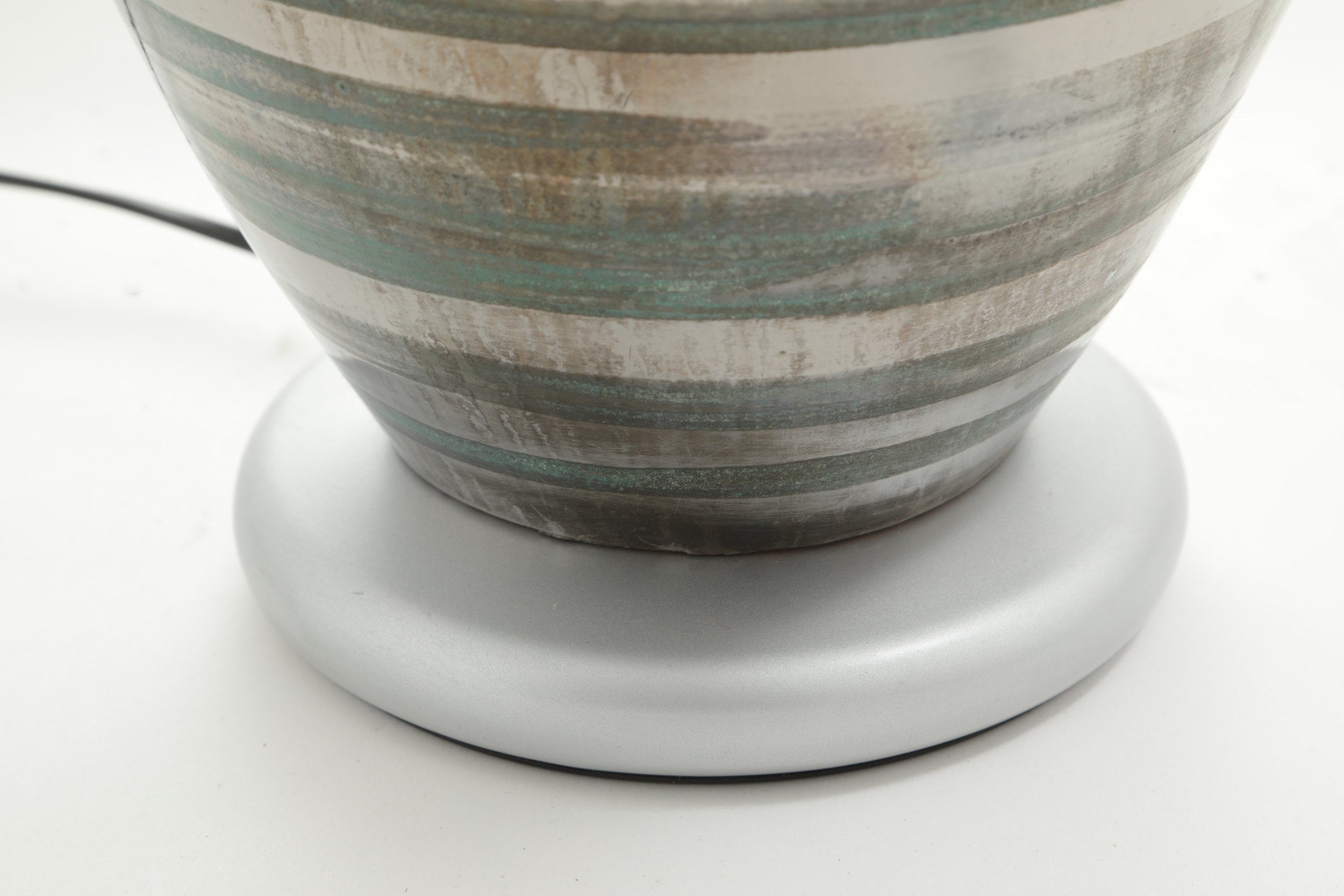 Pair of table lamps from the 70s in ceramic with silver bands