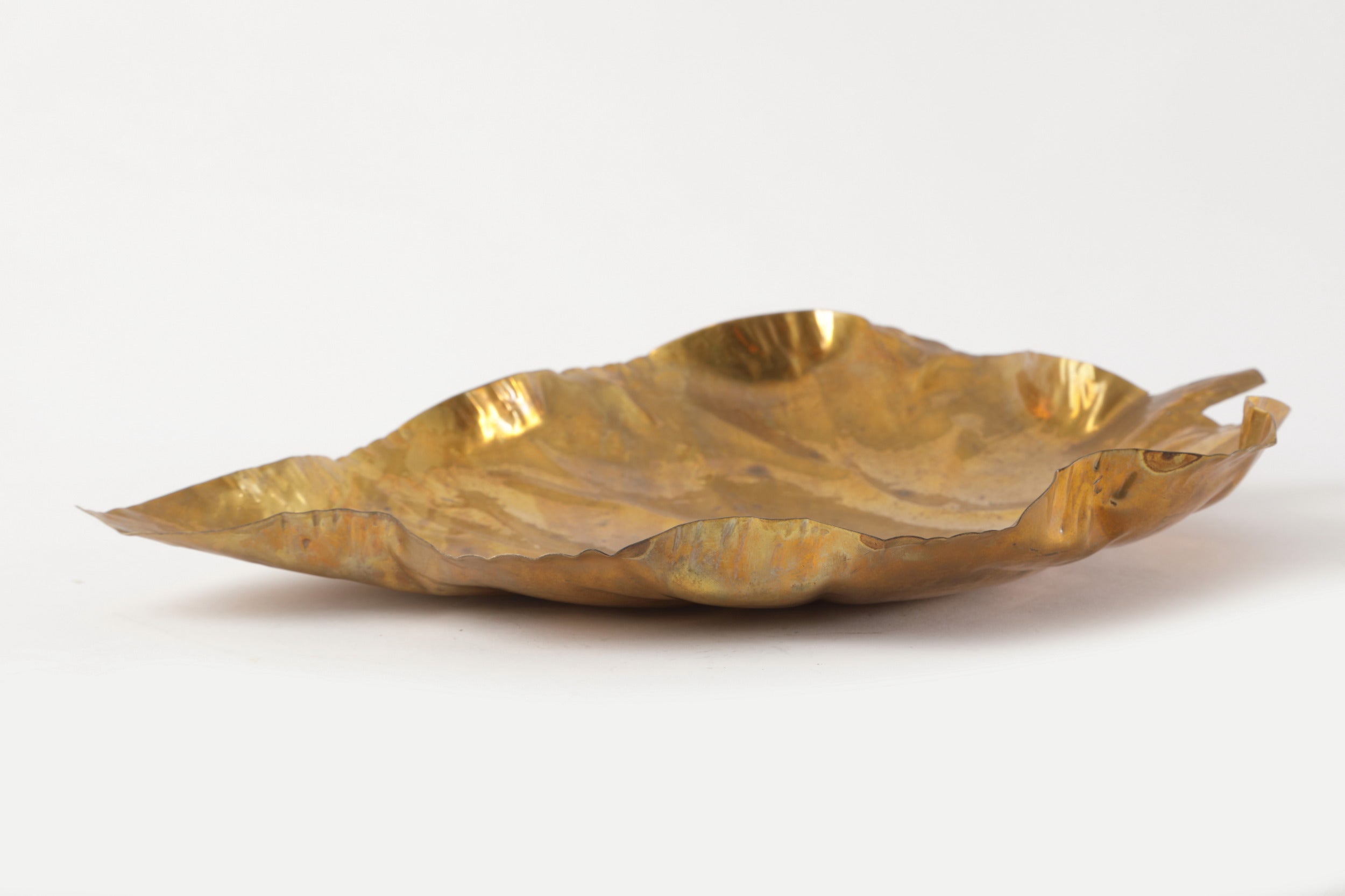 Pair of hand-hammered brass leaf centerpieces from the 1970s