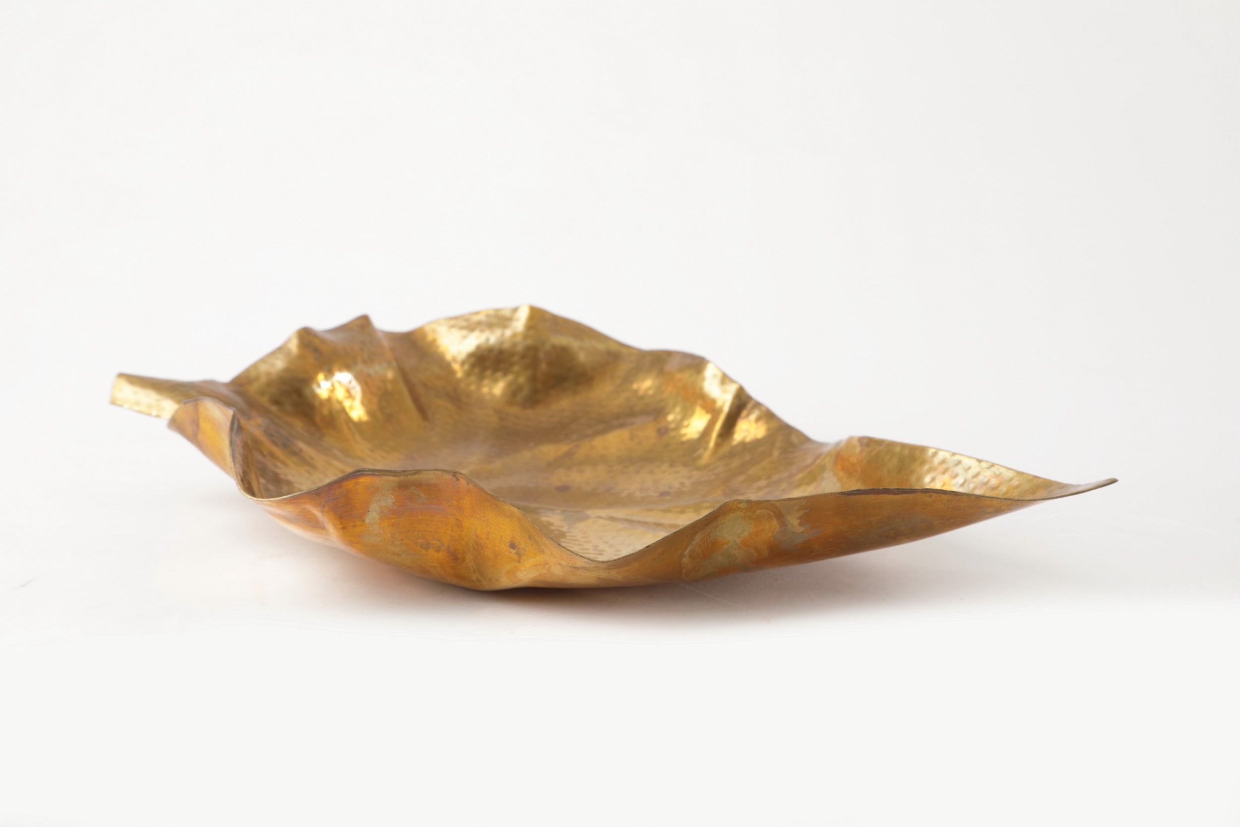 Pair of hand-hammered brass leaf centerpieces from the 1970s