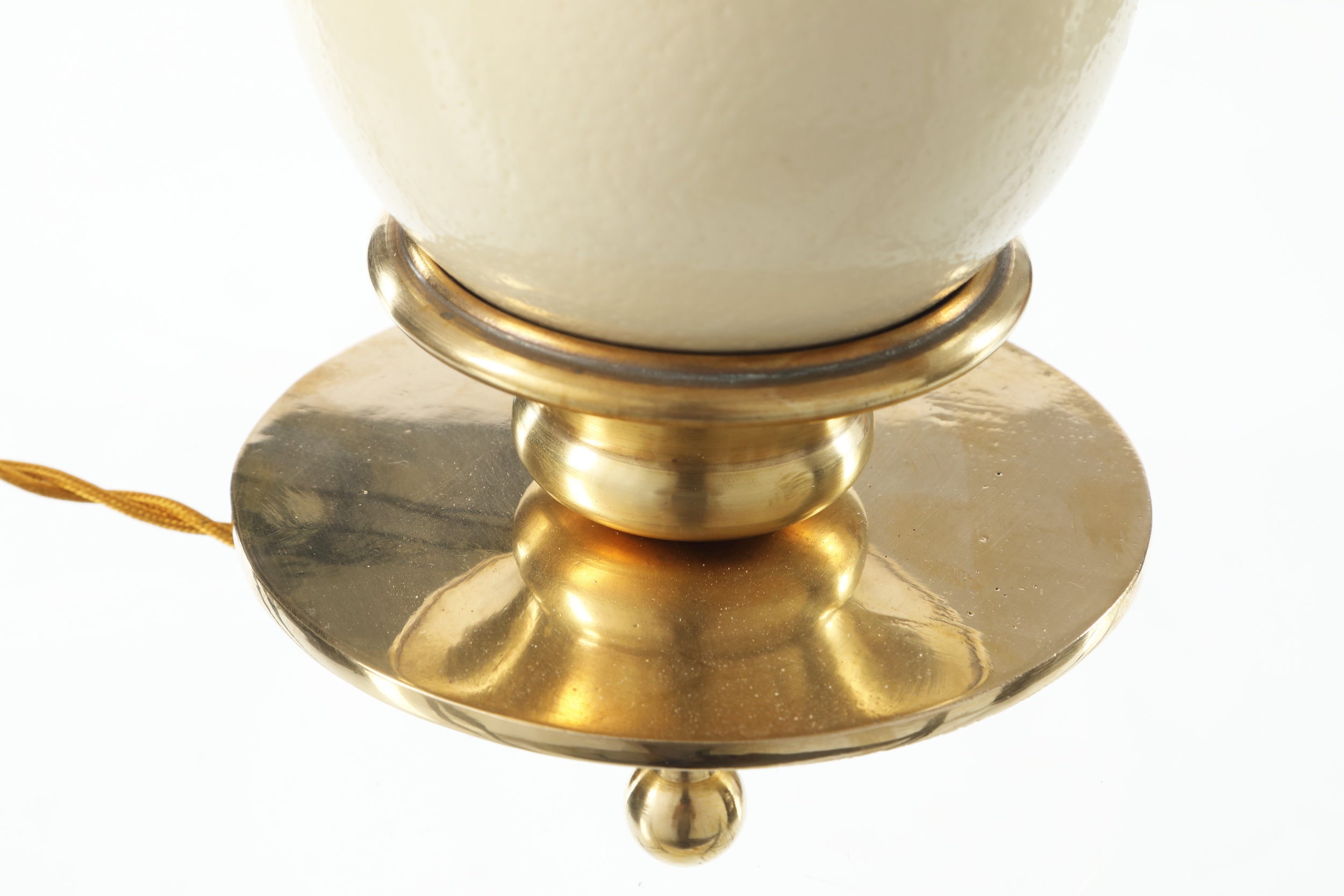 Ostrich egg and brass lamp