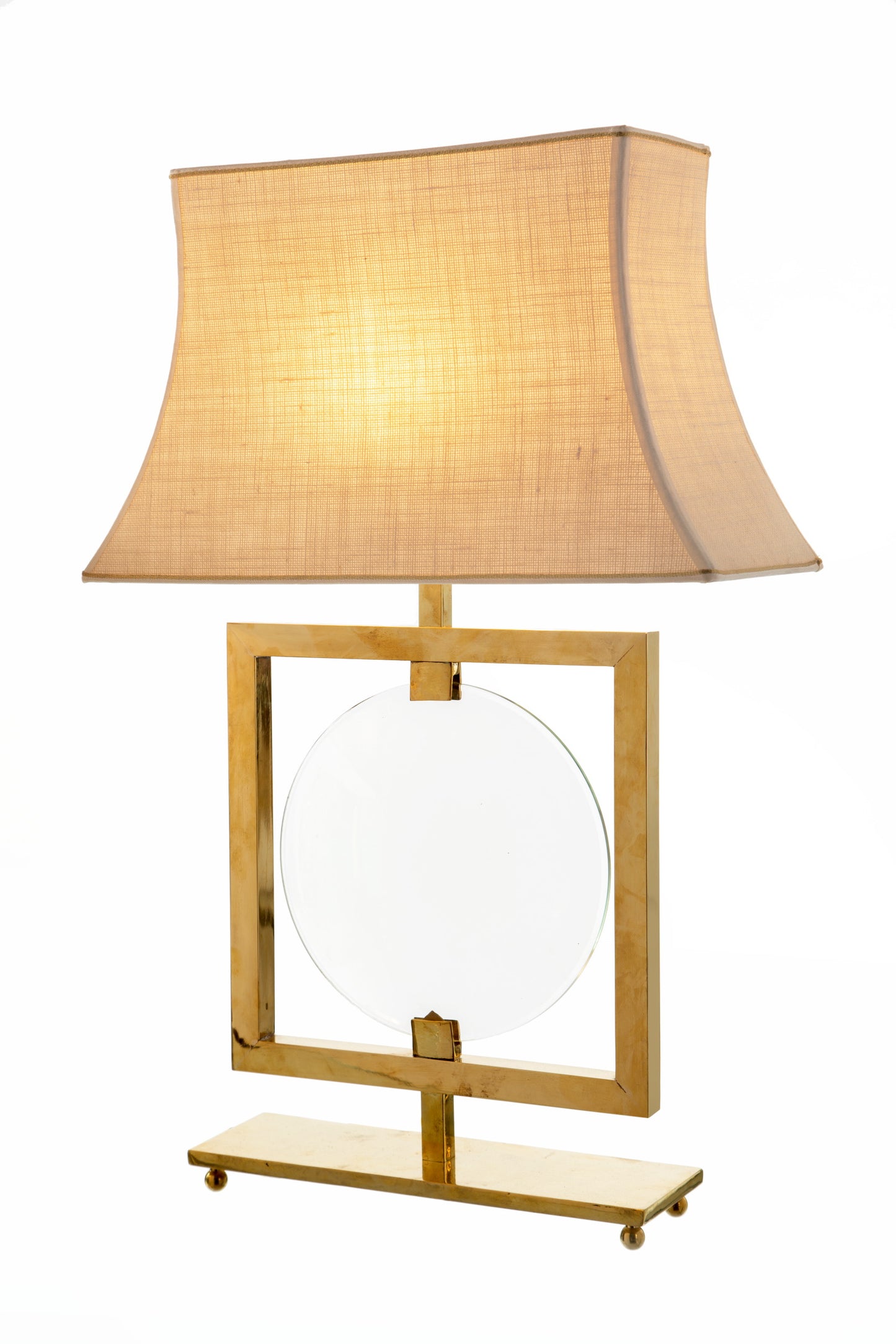 Pair of brass lamps with central lens