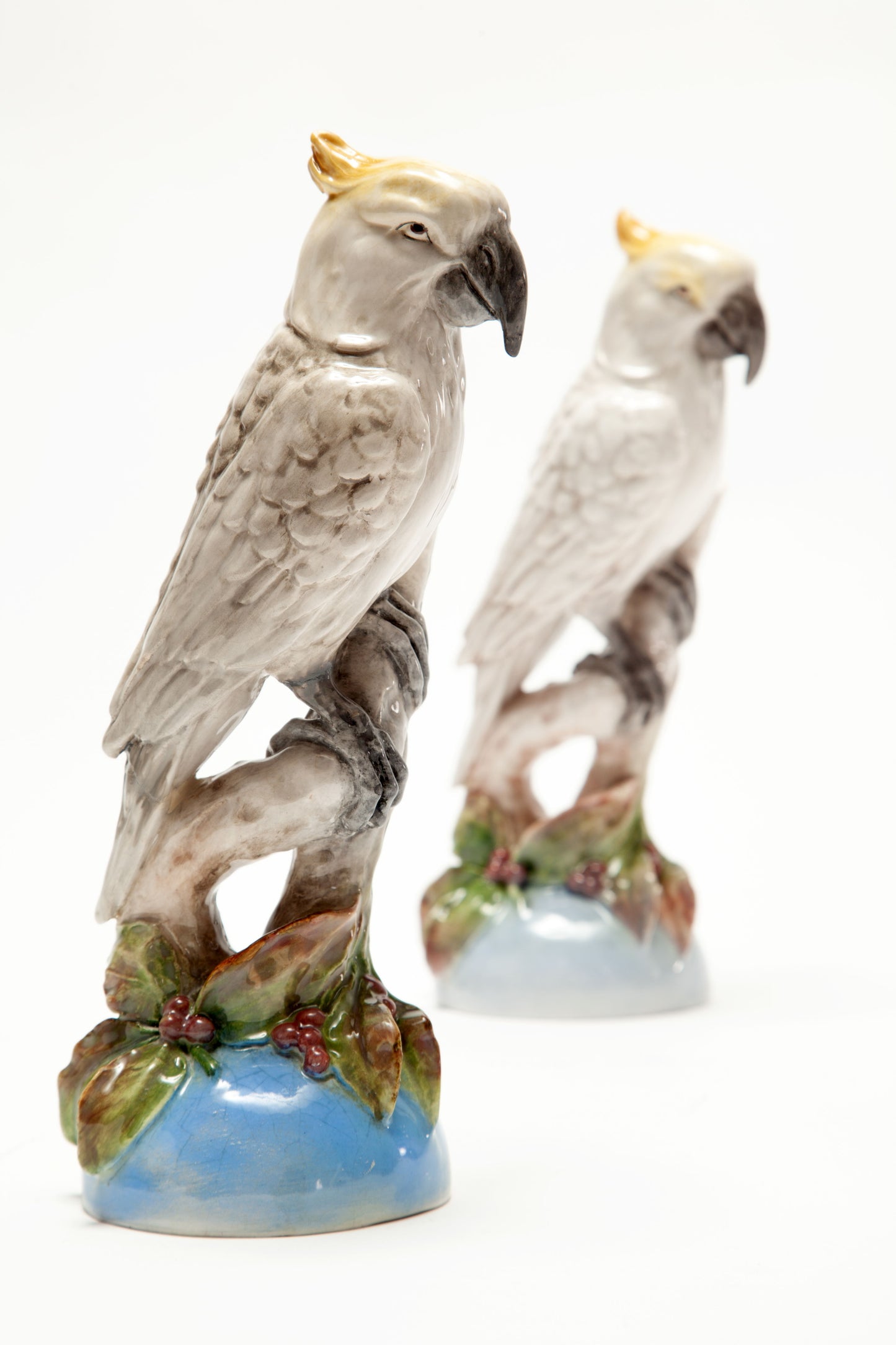 Pair of painted French ceramic parrots