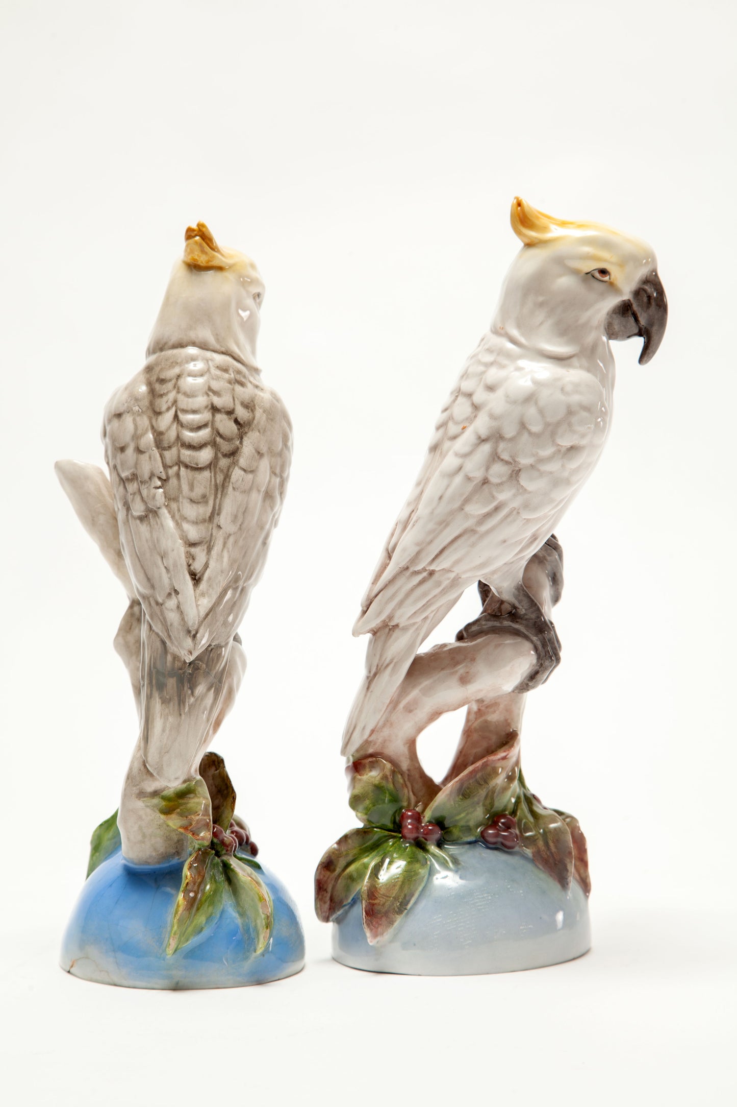 Pair of painted French ceramic parrots