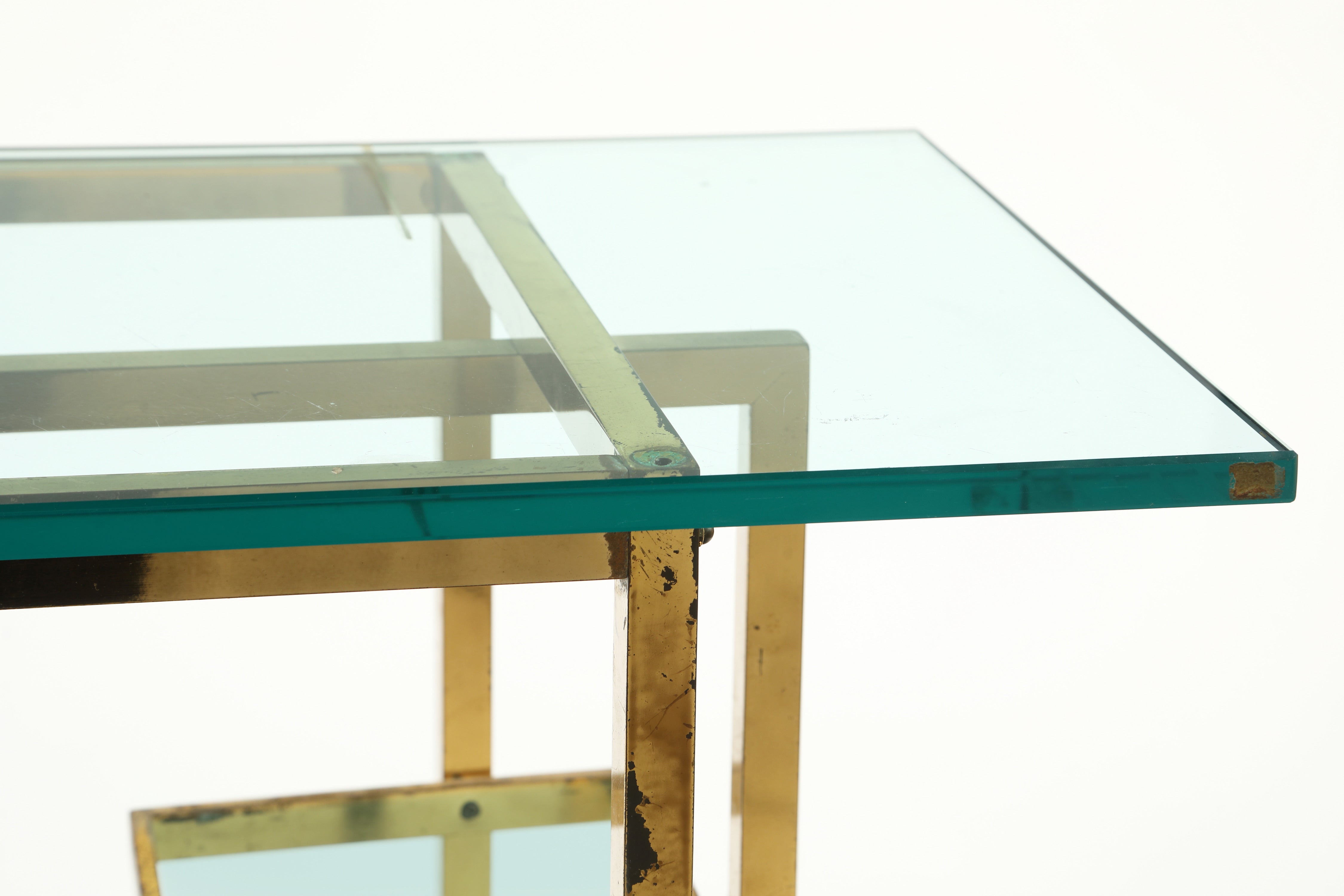 Console from the 70s with brass structure and glass tops