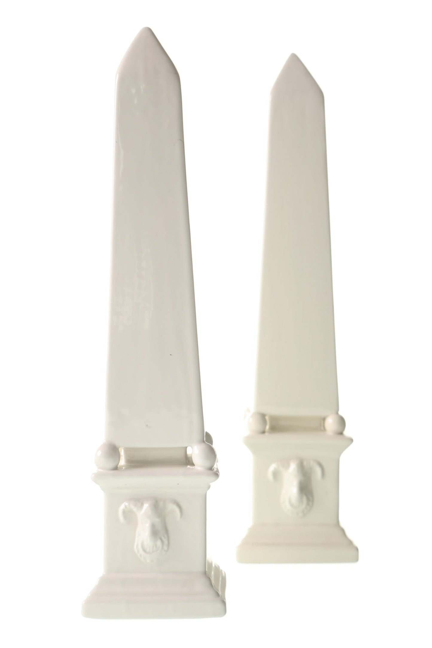 Pair of white ceramic obelisks