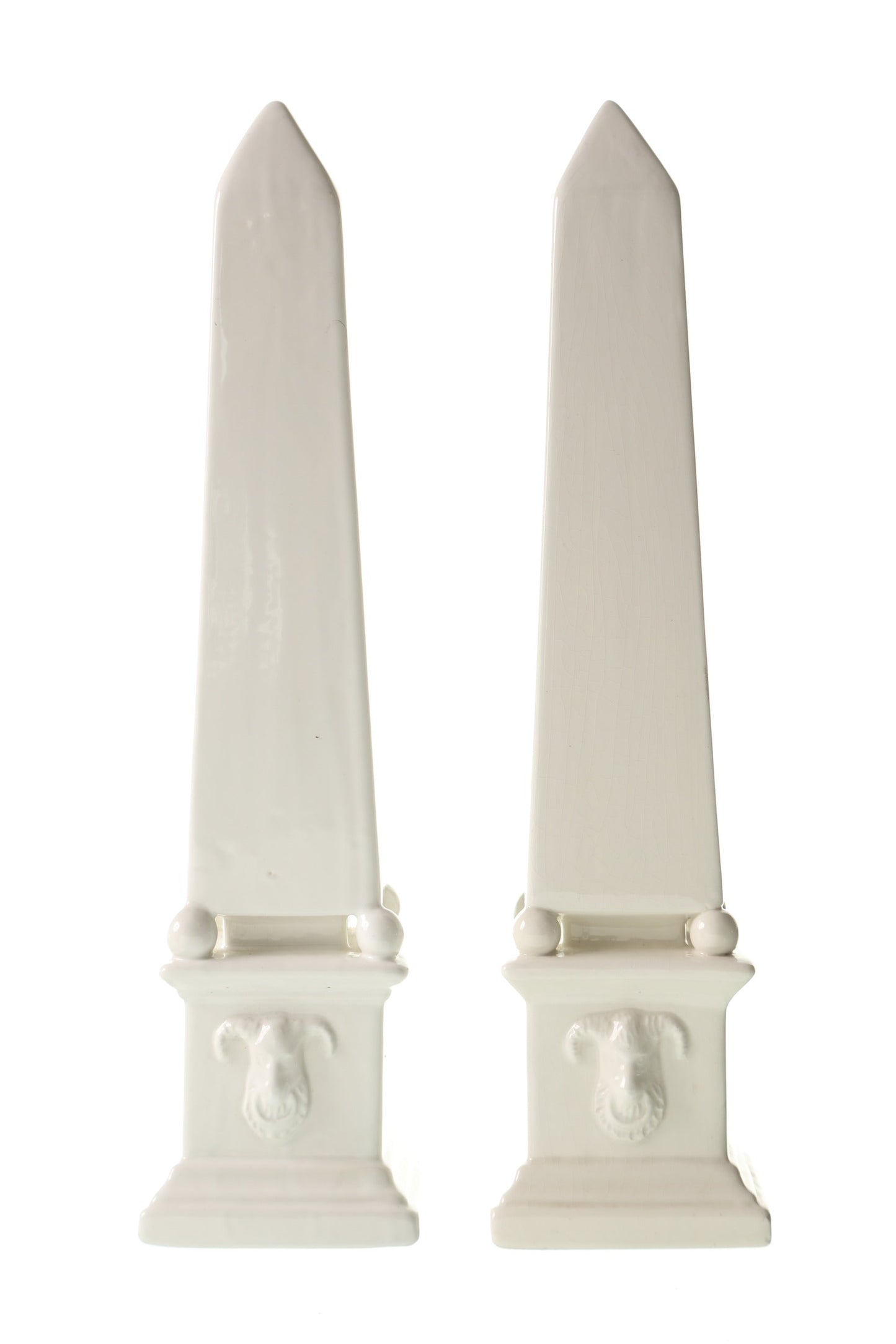 Pair of white ceramic obelisks