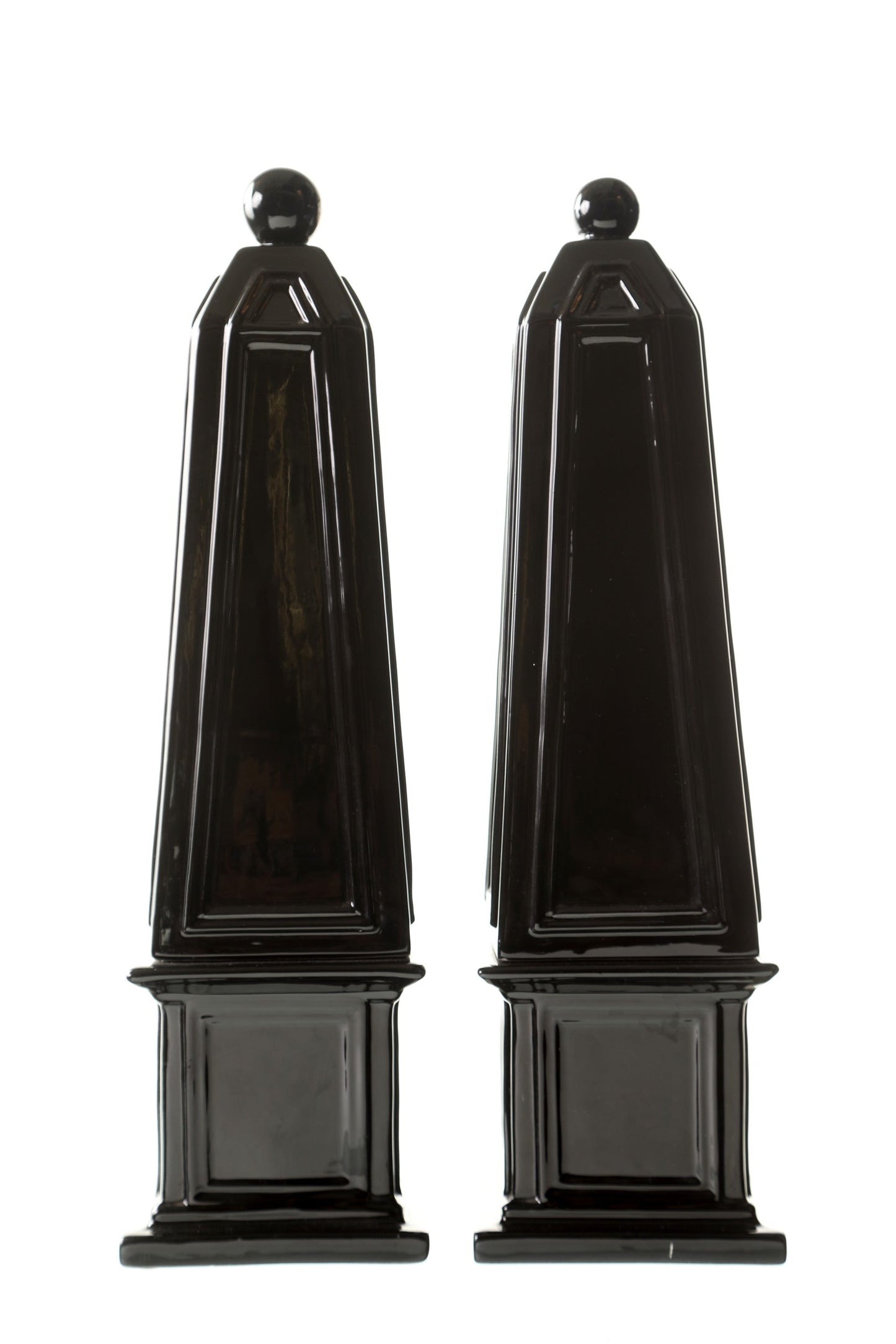 Pair of black ceramic obelisks