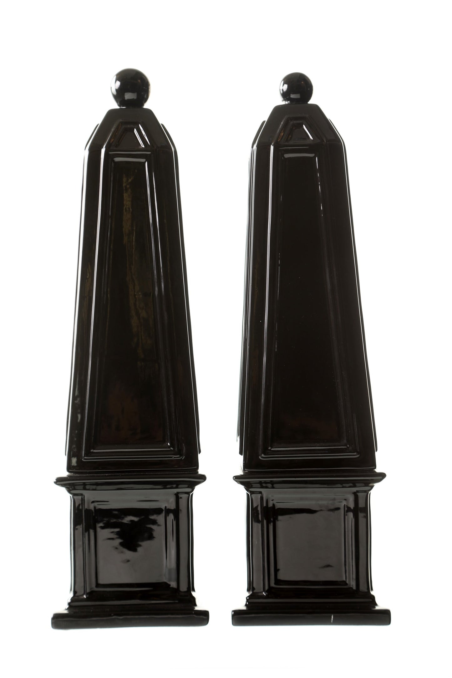 Pair of black ceramic obelisks