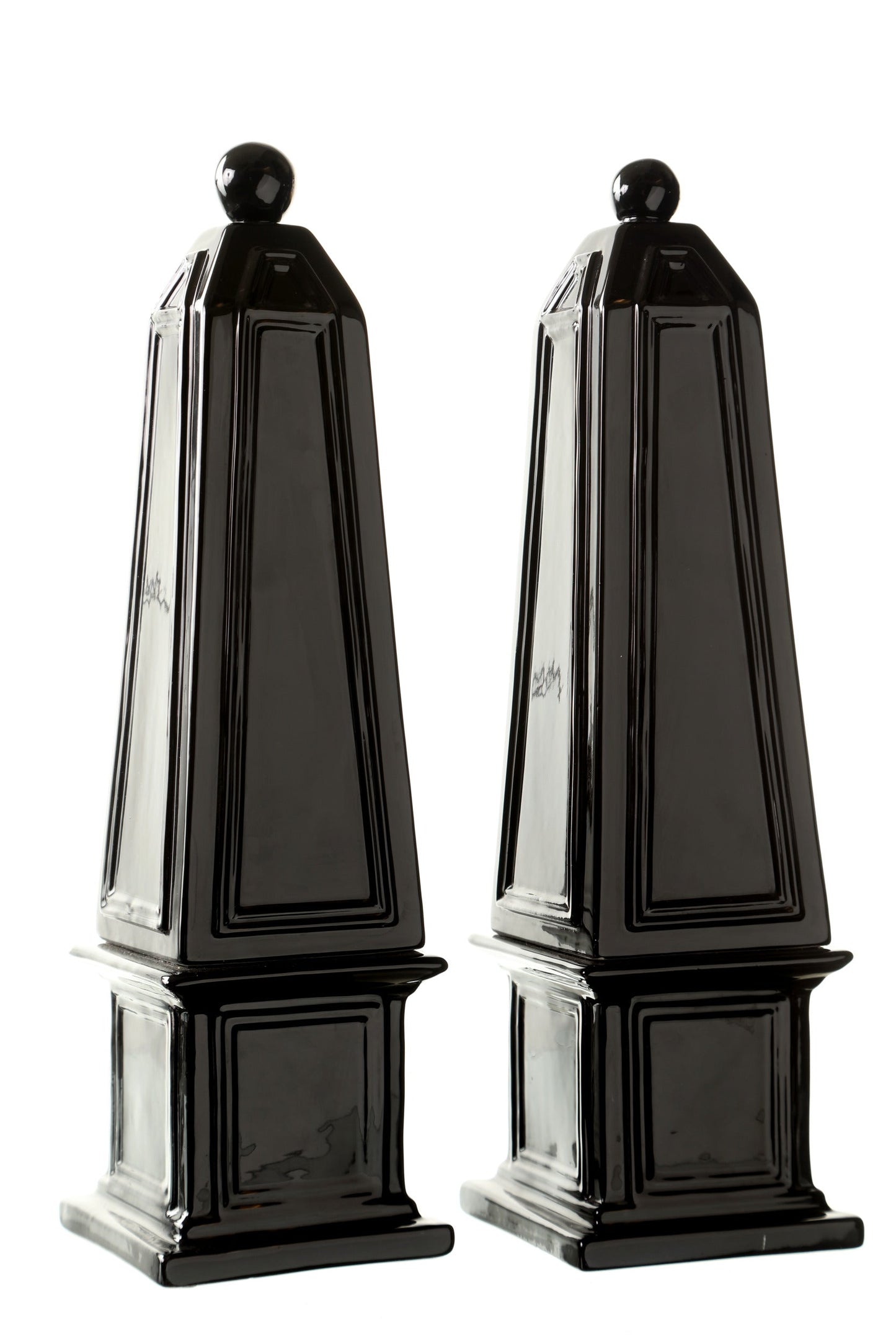 Pair of black ceramic obelisks