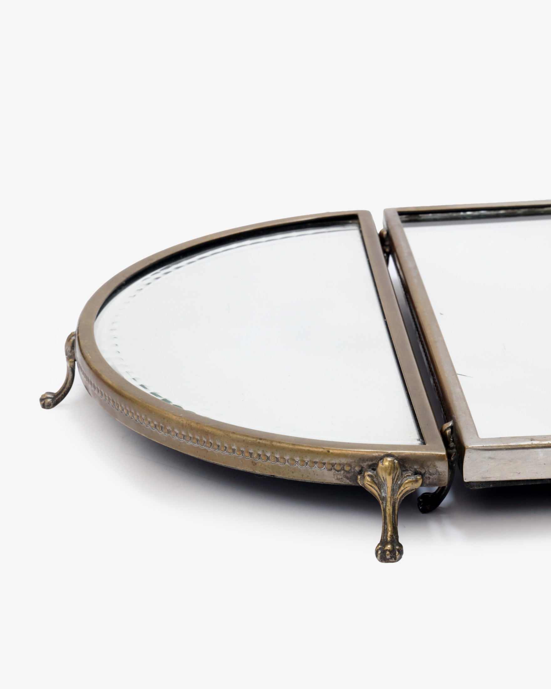 Triptych of mirrored trays with Loenine paws