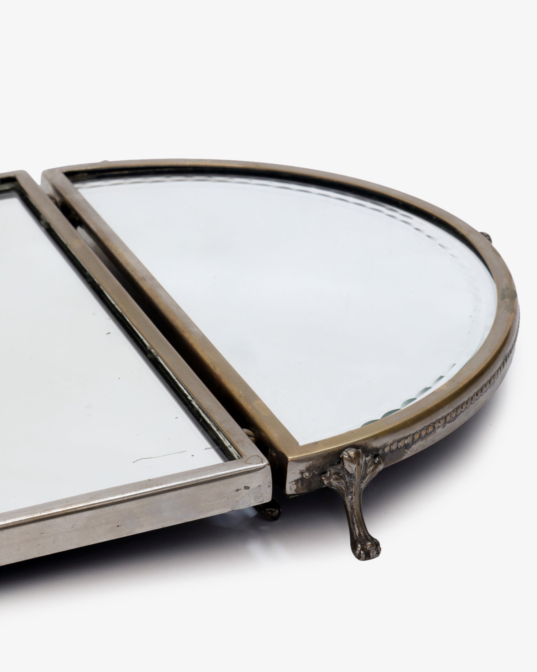 Triptych of mirrored trays with Loenine paws