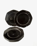 Six black octagonal placemats