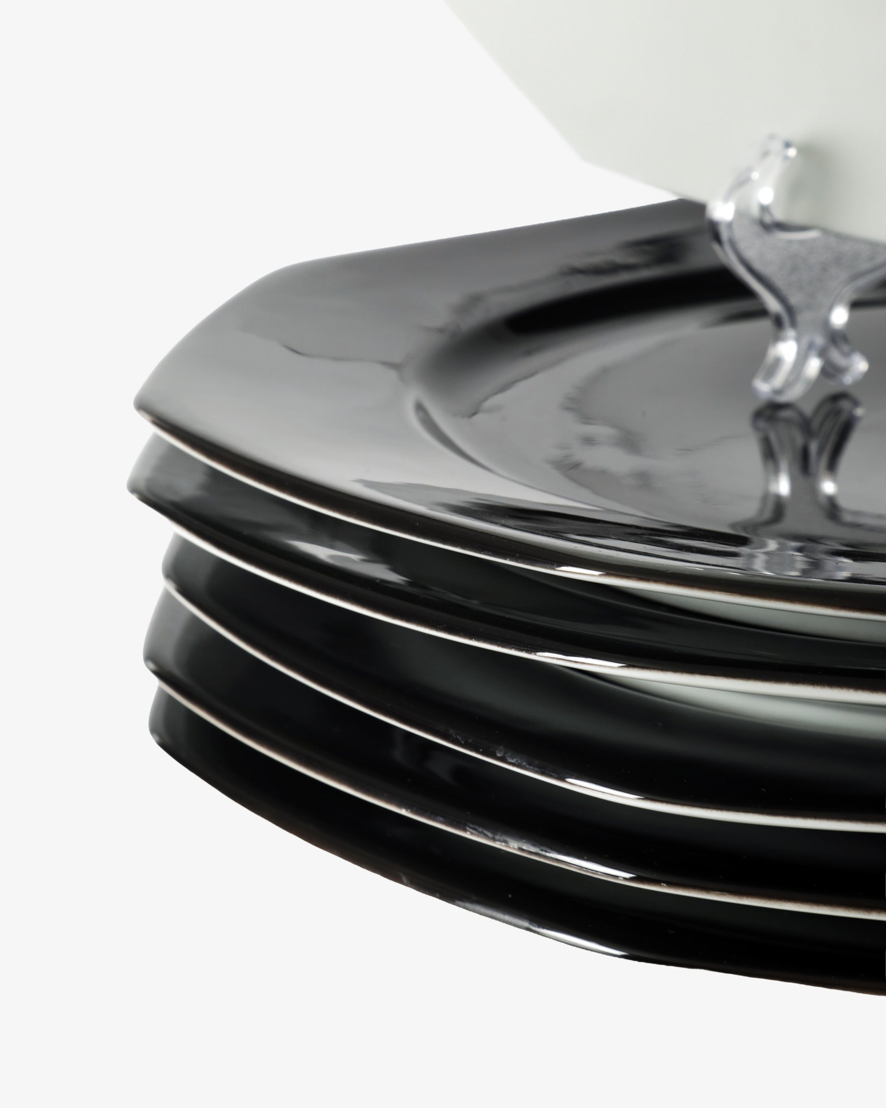 Six black octagonal placemats