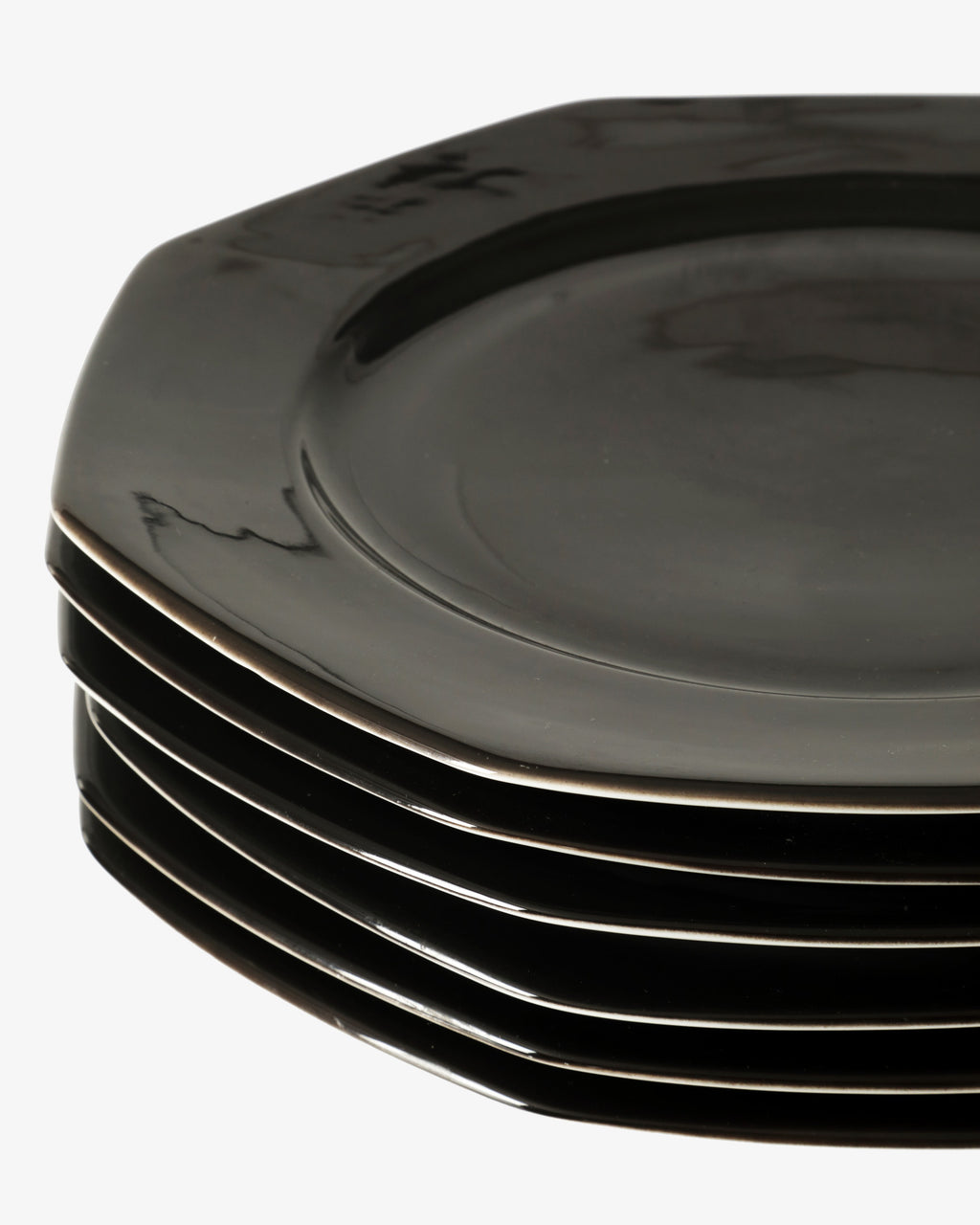 Six black octagonal placemats