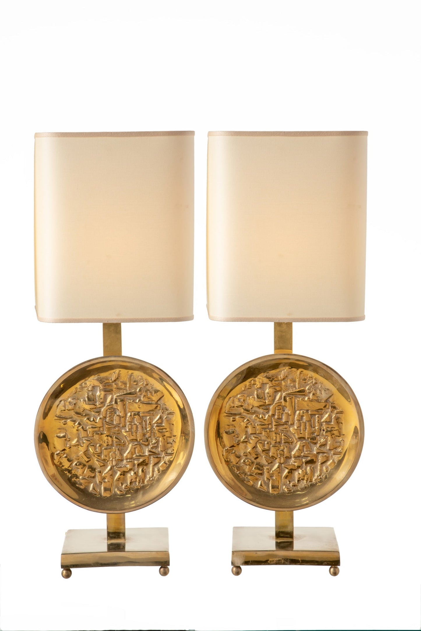 Pair of brass lamps with relief workmanship
