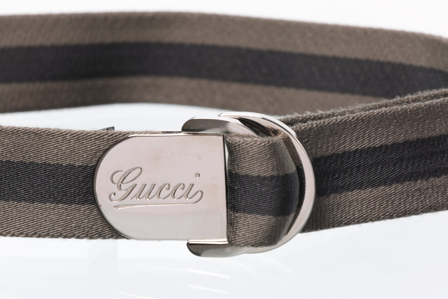 Mud and black Gucci belt
