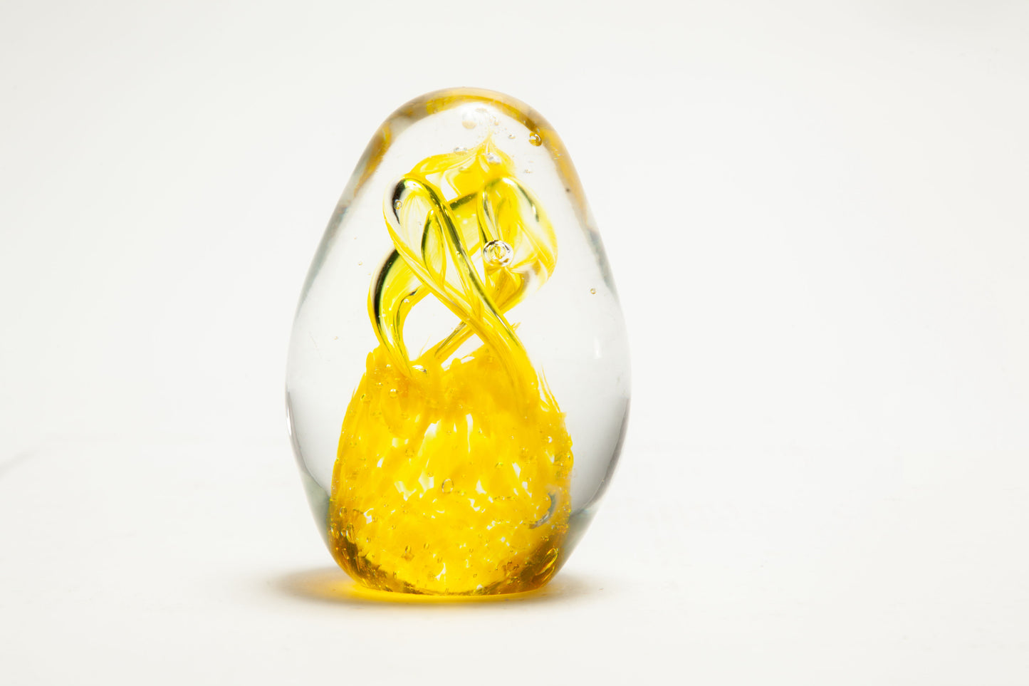 Murano glass paperweight with yellow decoration