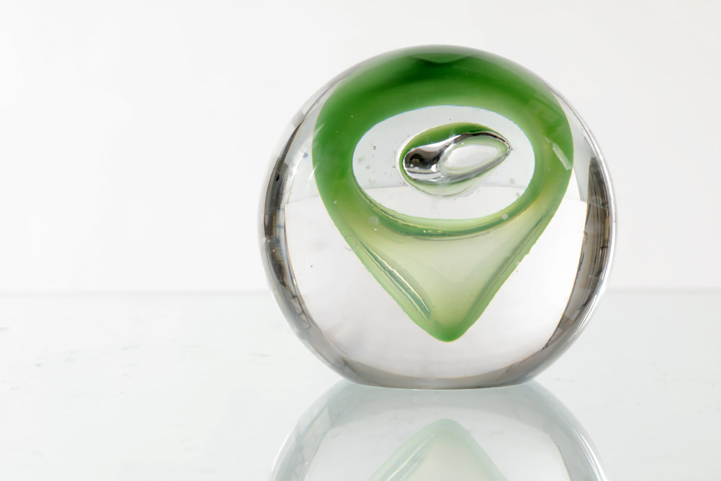 Murano glass paperweight with green decoration