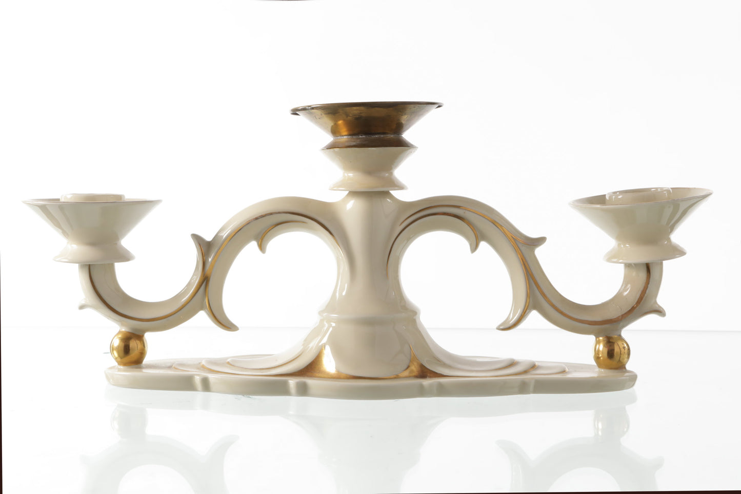 Small ivory and gold porcelain candlestick from the 1950s
