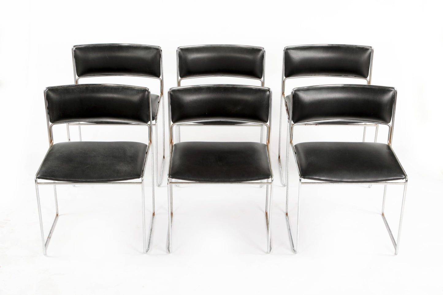 Six black leather chairs