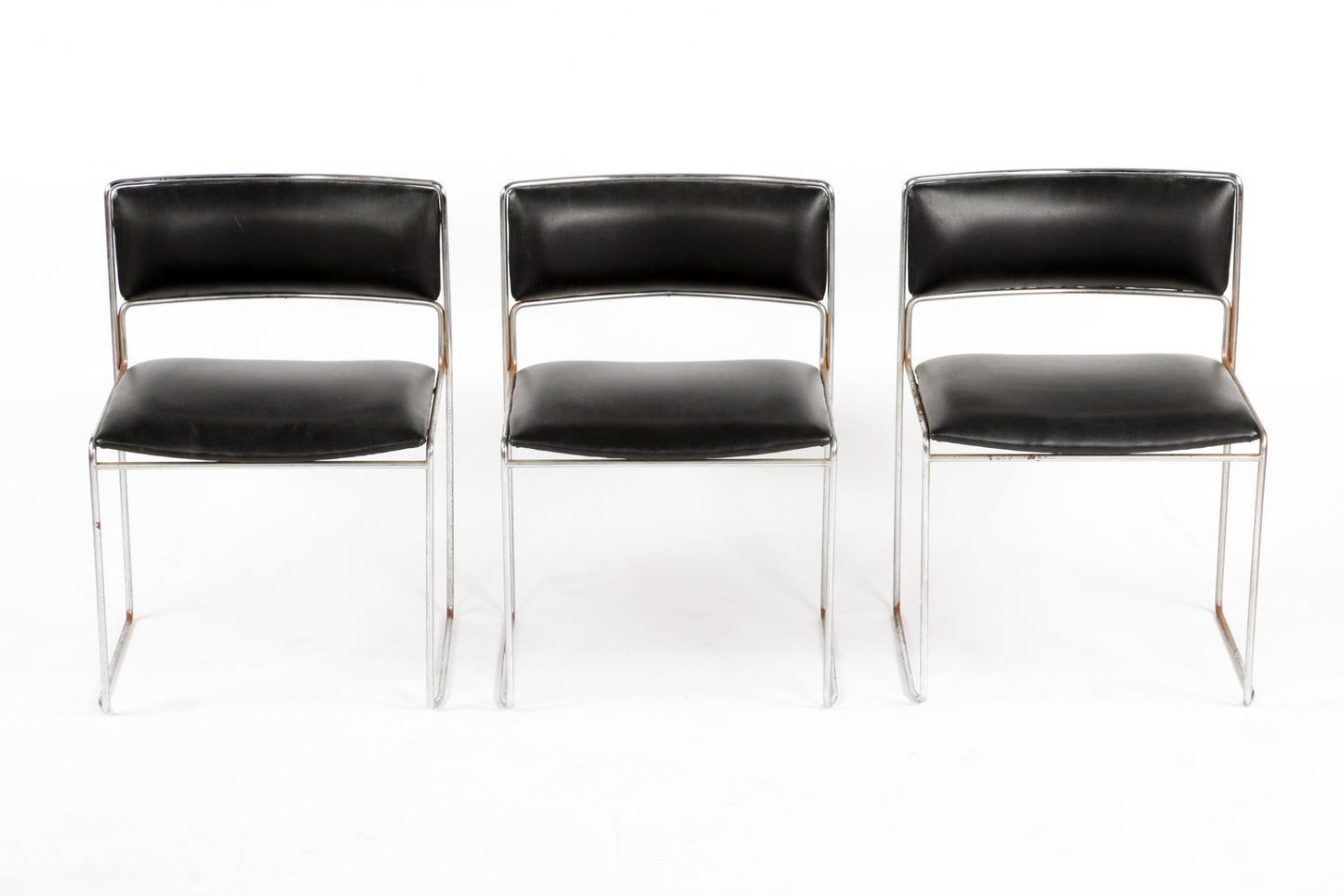 Six black leather chairs