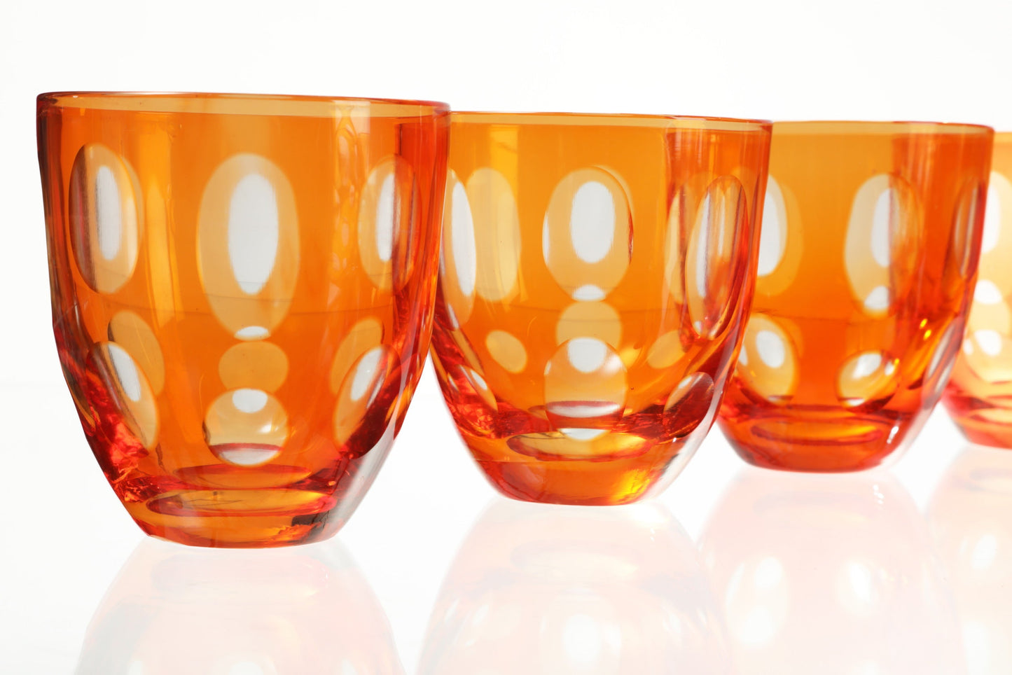 Orange crystal glass set with sphere motif