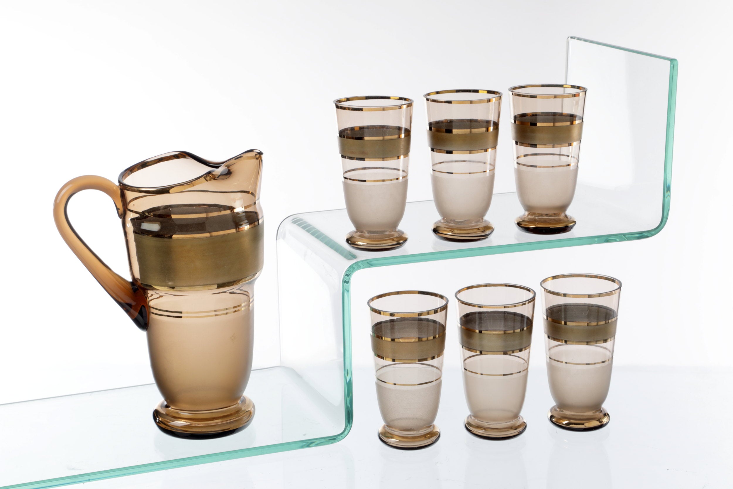 Pitcher set with six smoked glass glasses