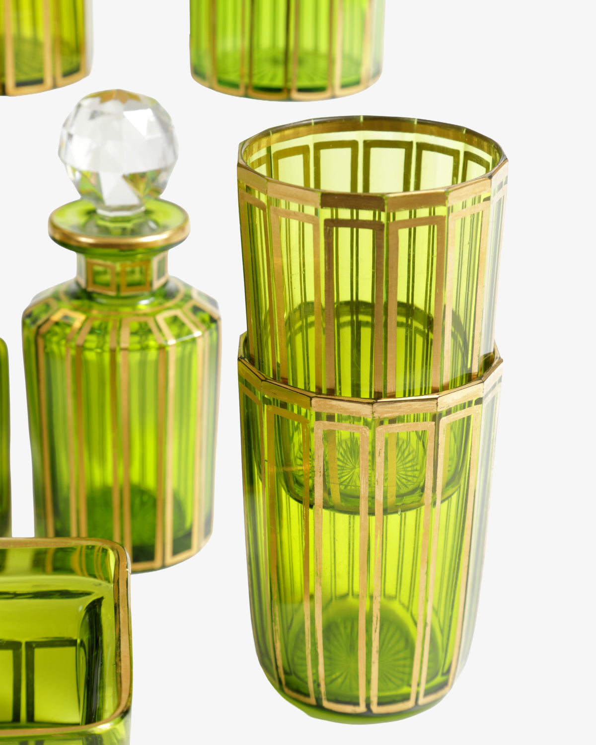 Set of green and gold glass perfume bottles from the 1960s