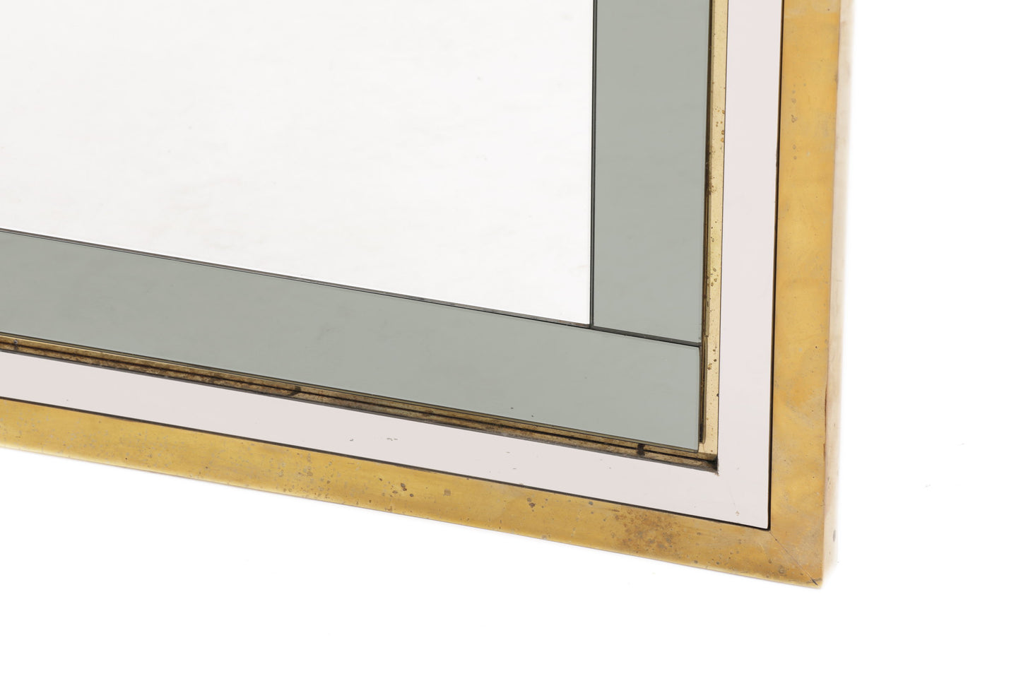 Mirror from the 70s in steel and brass with applied glass profiles