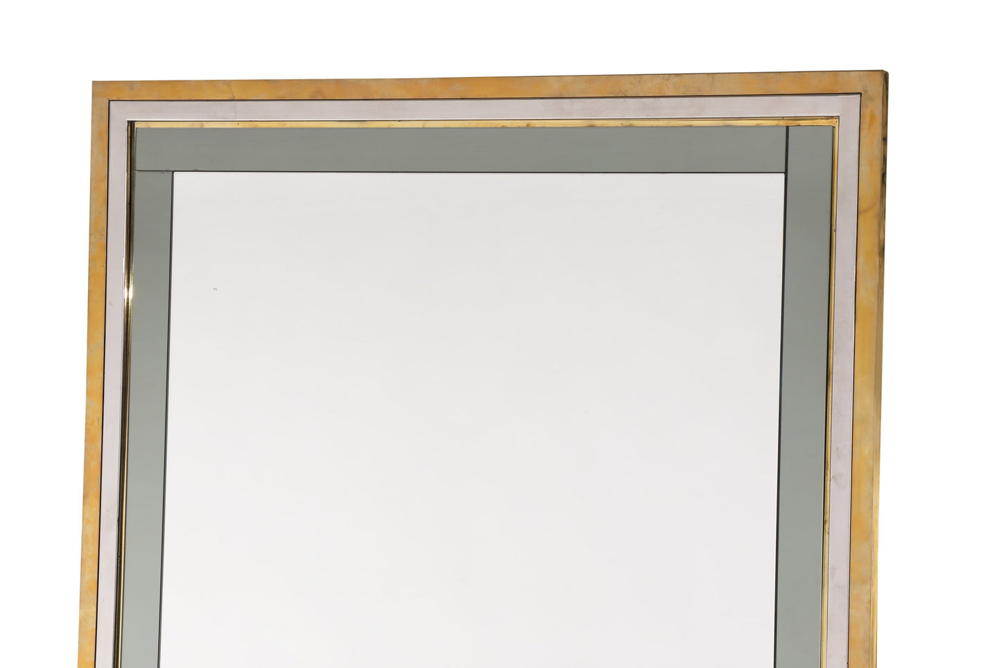 Mirror from the 70s in steel and brass with applied glass profiles