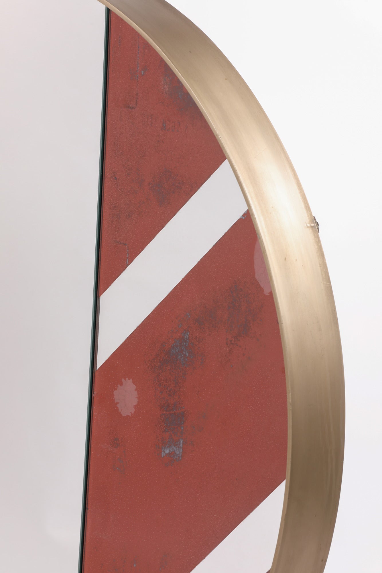 Mirror from the 70s in steel with red band inserts