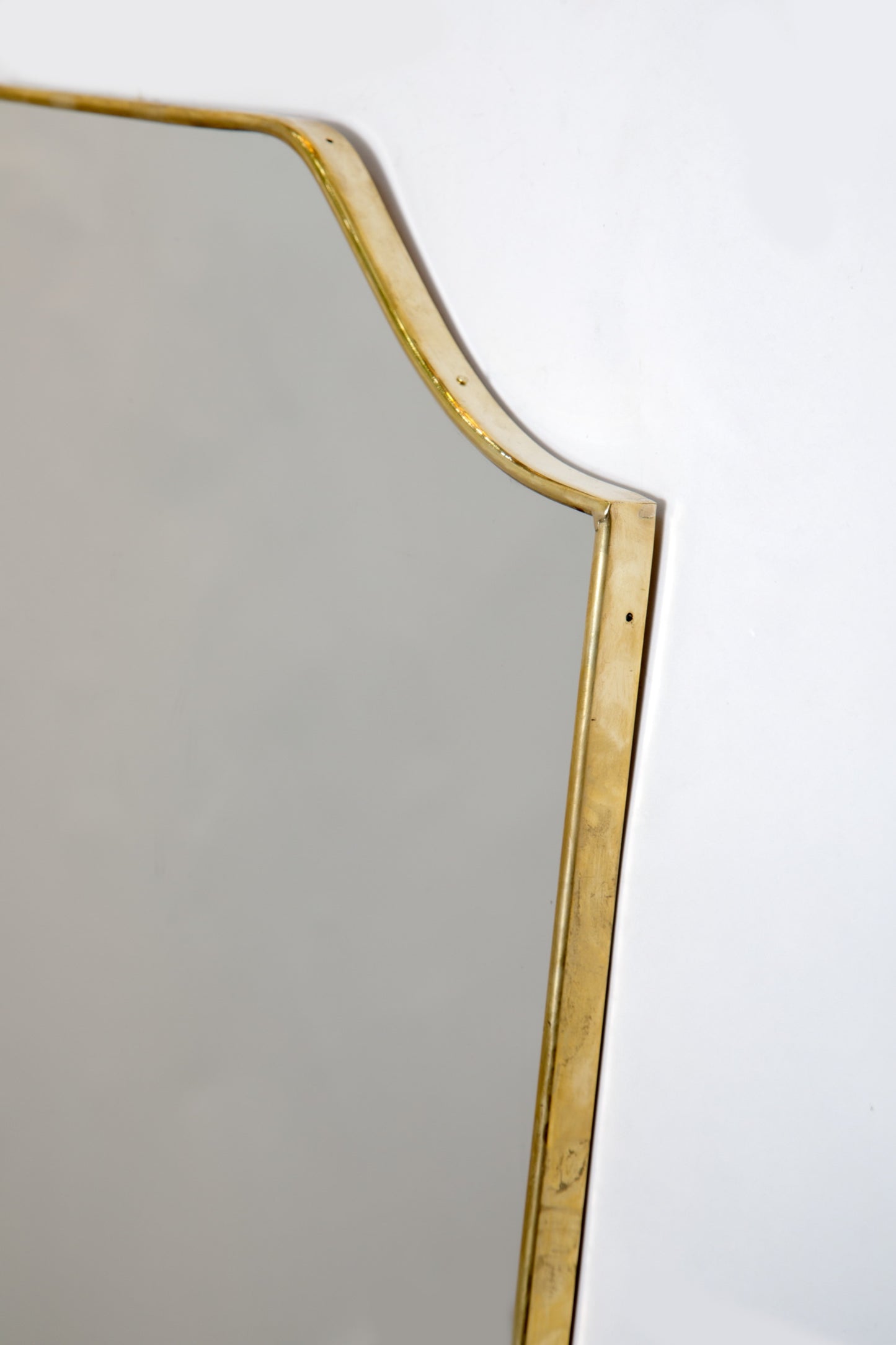 1960s brass mirror with rounded corners