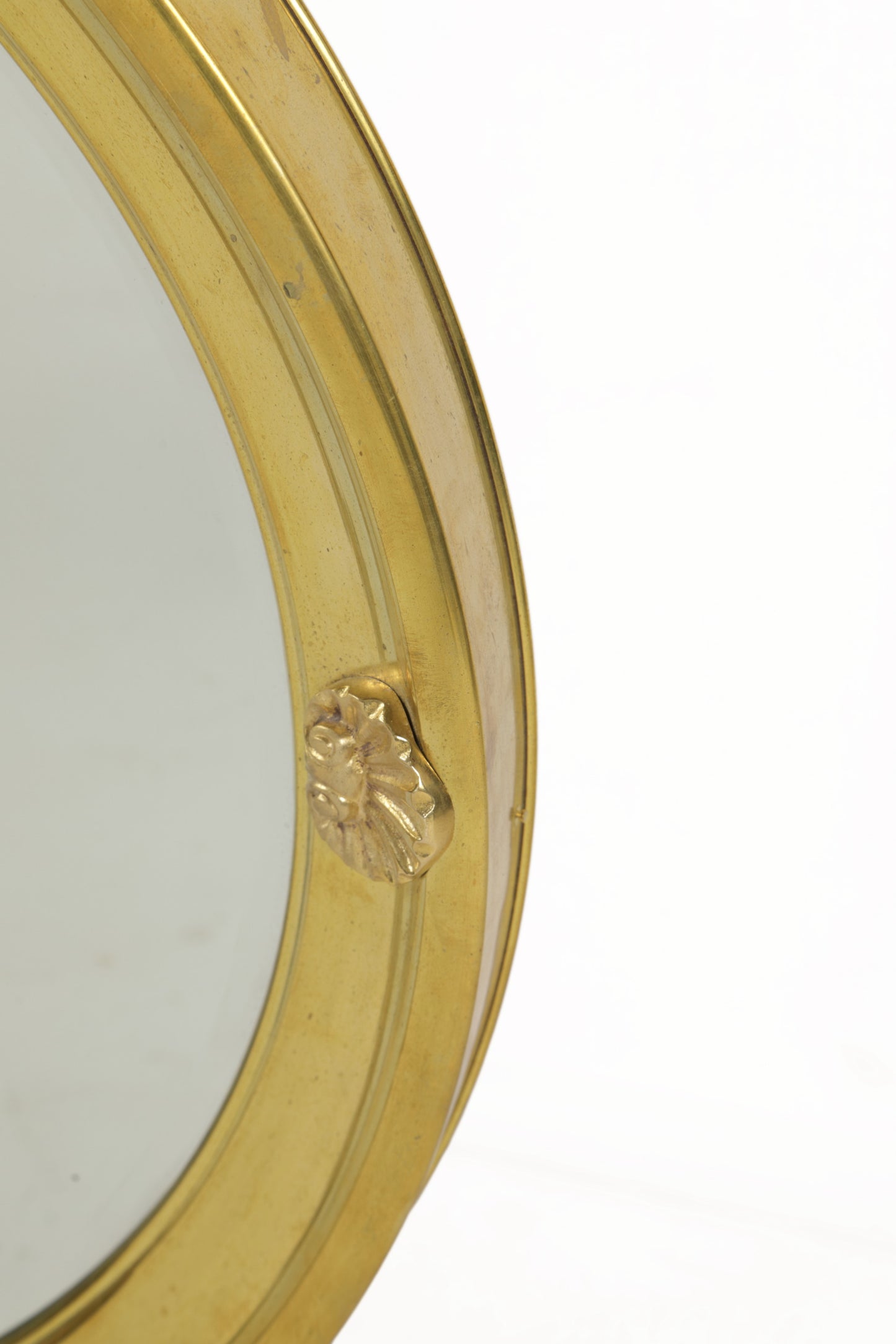 Round beveled mirror from the 1950s with golden shell frame