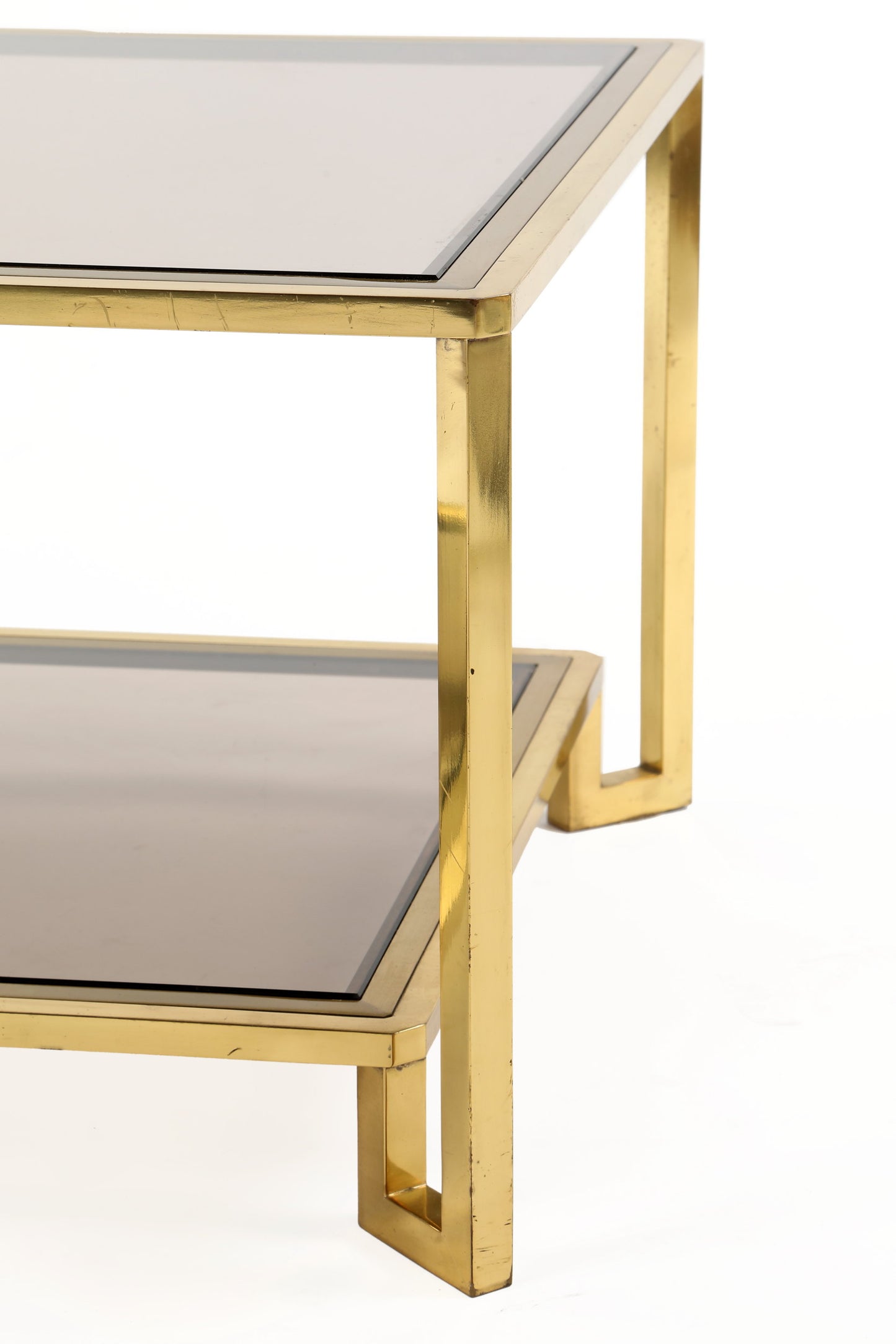 Living room table from the 70s in brass with double smoked glass shelf