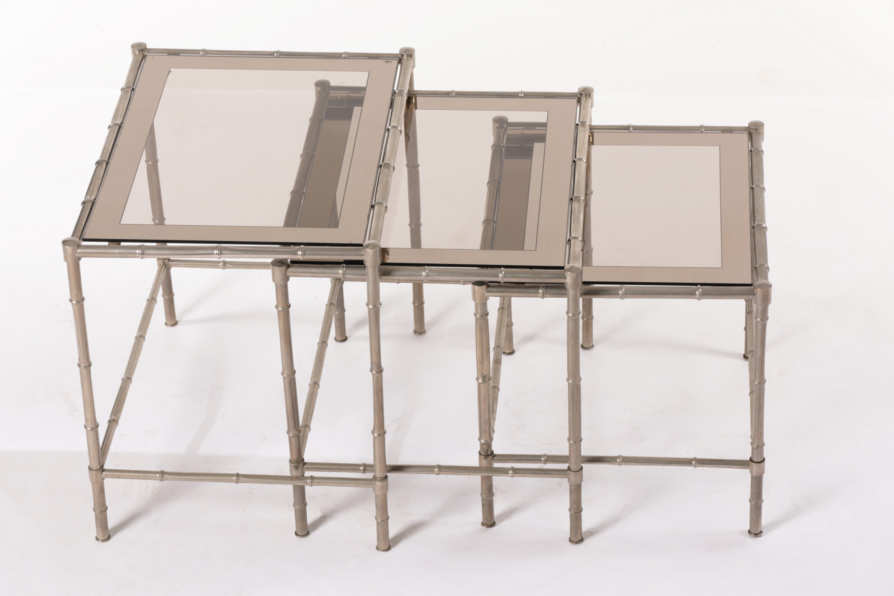 Triptych of silver bamboo tables from the 70s