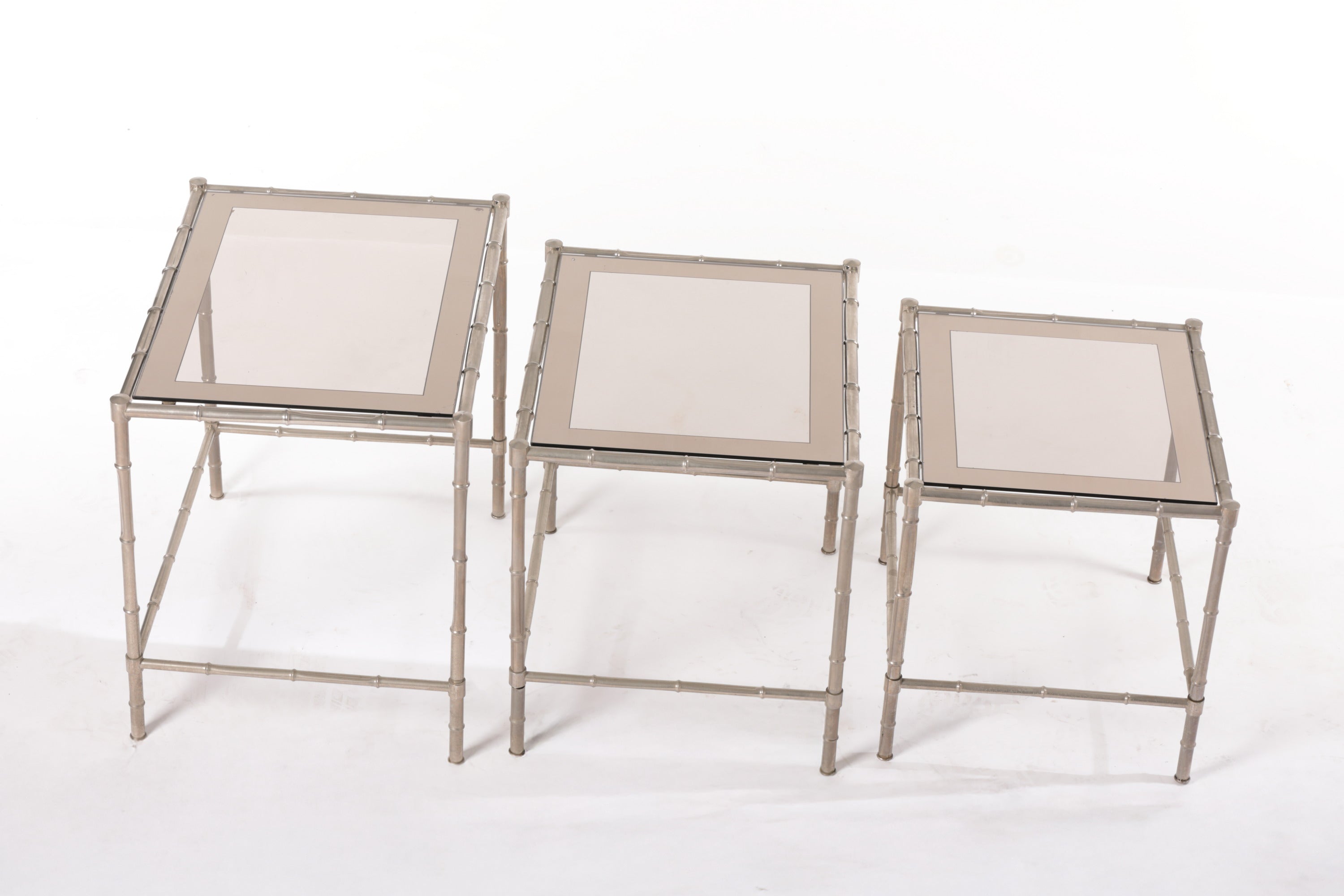 Triptych of silver bamboo tables from the 70s