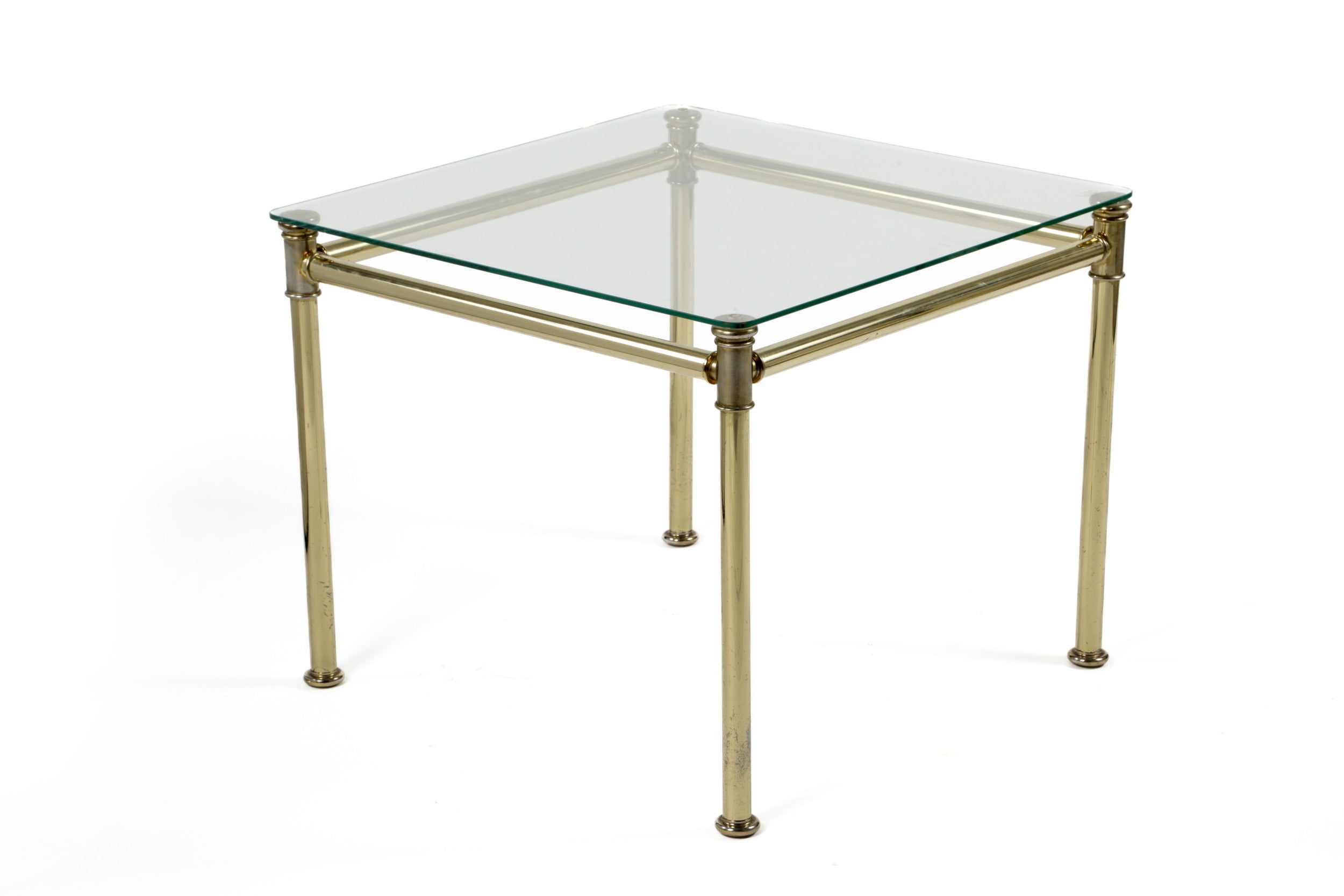 Triptych of brass and smoked glass tables from the 70s