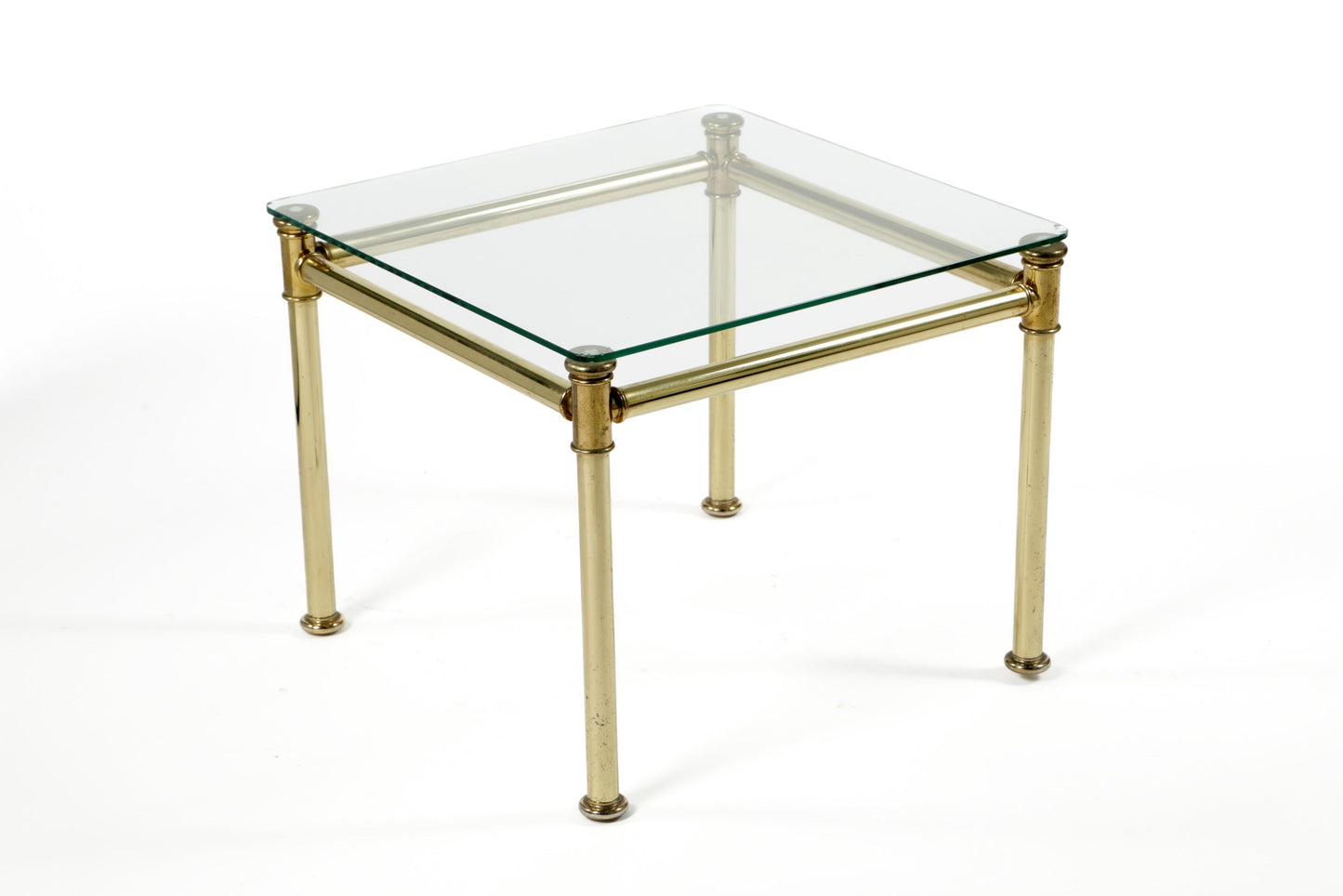 Triptych of brass and smoked glass tables from the 70s