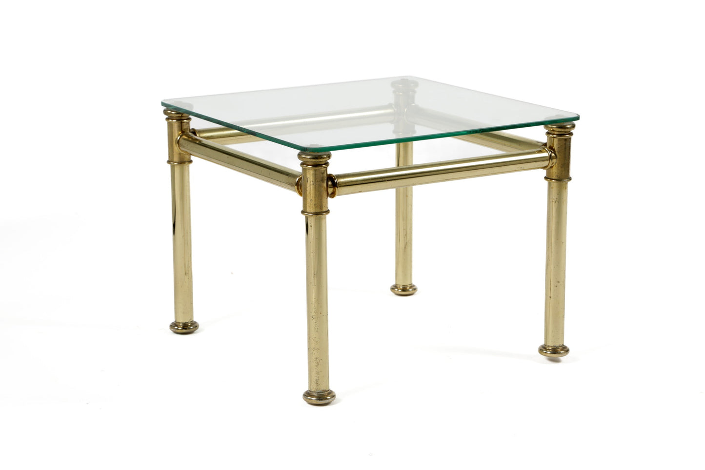 Triptych of brass and smoked glass tables from the 70s